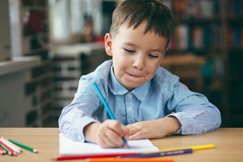 Preschool boy drawing